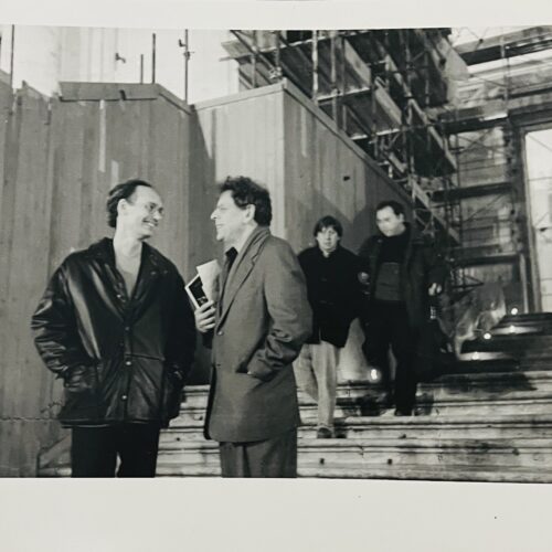 PHOTOGRAPH OF PHILIP GLASS & MICHAEL HARRISON AT THE  4 PIANOFORTI EXHIBITION. 1999.